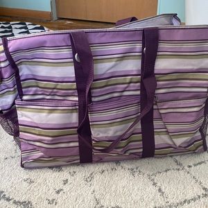 Green, purple, gray striped bag with zipper top